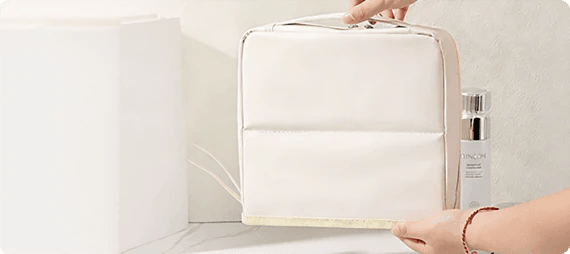 Closed ivory organizer standing on a dressing table