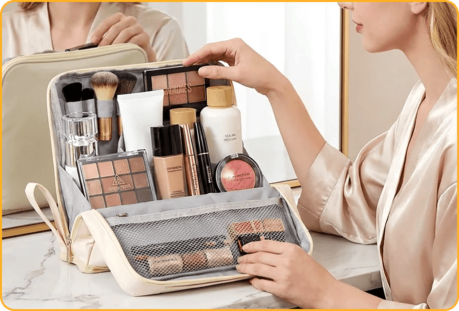 Open cosmetic organizer holding brushes, bottles, palettes and small makeup items