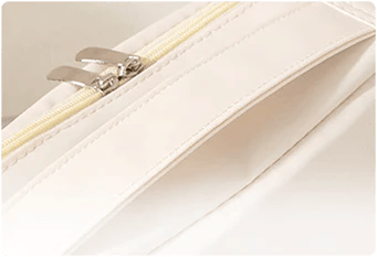 Close-up of the organizer zipper and rear attachment strap